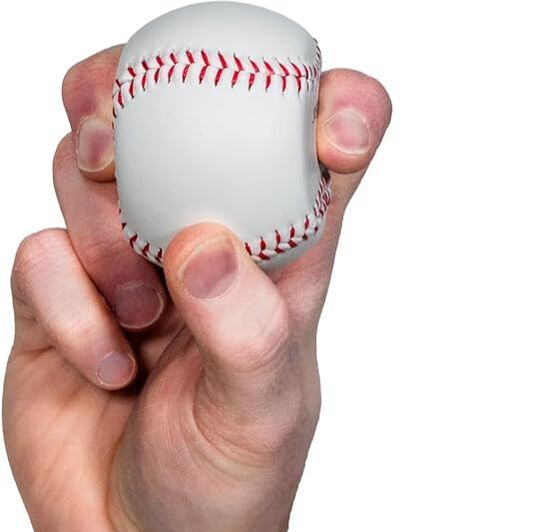 Split finger pitch grip on baseball spinner